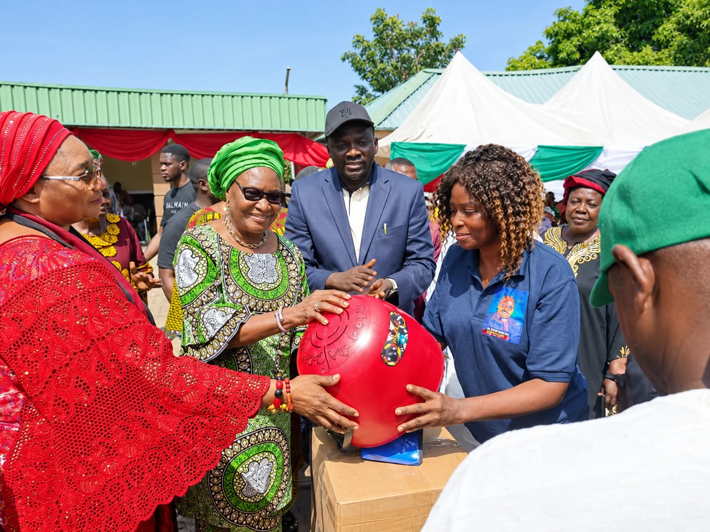 Ceremonial presentation associated with the hair dryer project